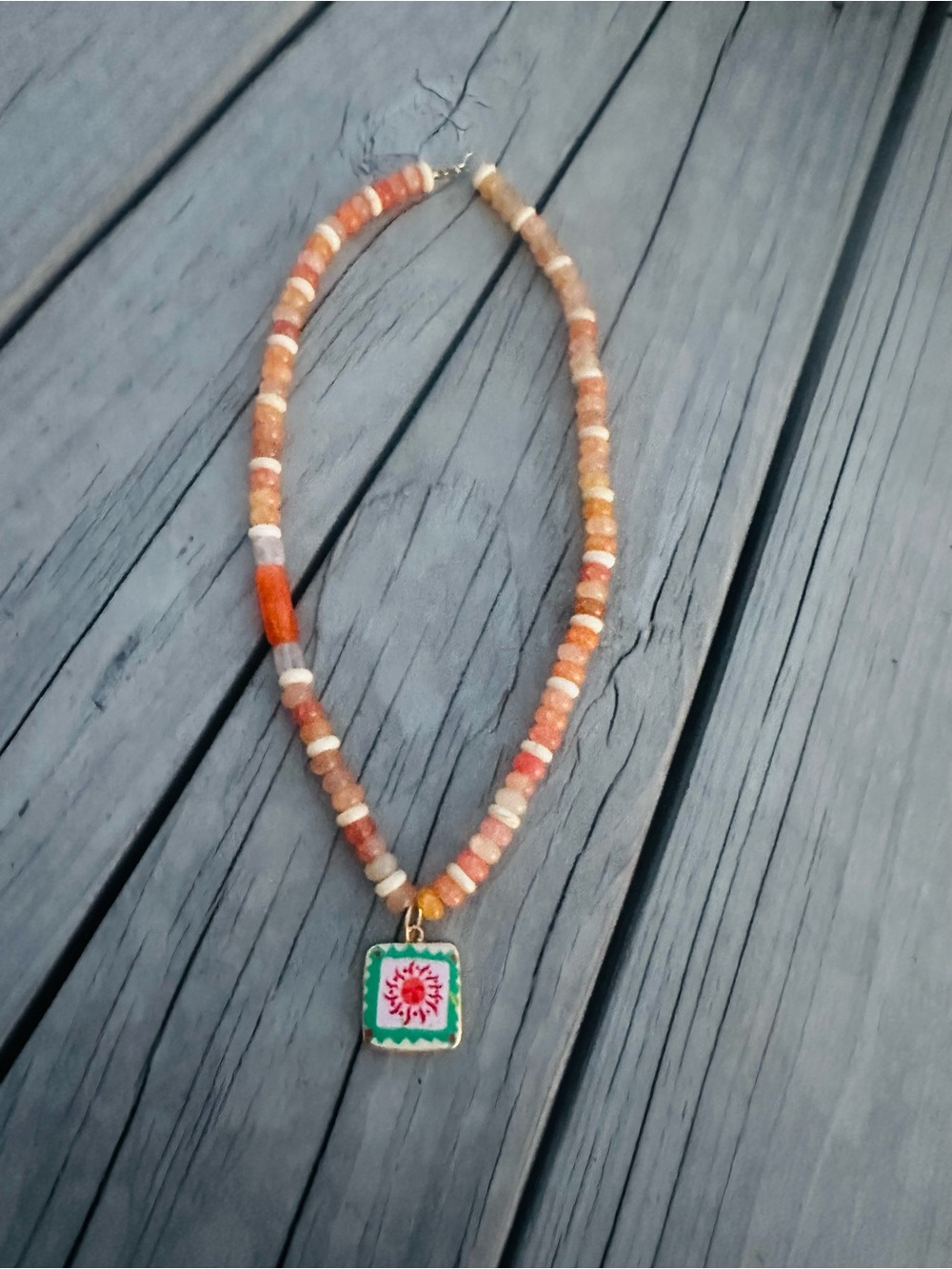 Handmade glass Orange Beaded Necklace with Green Floral Pendant